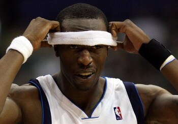DALLAS - APRIL 25:  Forward Josh Howard #5 of the Dallas Mavericks adjusts his head band during play against the San Antonio Spurs in Game Four of the Western Conference Quarterfinals during the 2009 NBA Playoffs at American Airlines Center on April 25, 2