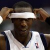 DALLAS - APRIL 25:  Forward Josh Howard #5 of the Dallas Mavericks adjusts his head band during play against the San Antonio Spurs in Game Four of the Western Conference Quarterfinals during the 2009 NBA Playoffs at American Airlines Center on April 25, 2