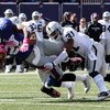 EAST RUTHERFORD, NJ - OCTOBER 11:  Brandon Jacobs #27 of the New York Giants is tackled by Tyvon Branch #33 and Hiram Eugene #31 of the Oakland Raiders on October 11, 2009 at Giants Stadium in East Rutherford, New Jersey.  (Photo by Jim McIsaac/Getty Imag
