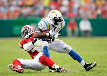 KANSAS CITY, MO - OCTOBER 25:  LaDainian Tomlinson #21 of the San Diego Chargers carries the ball as Demorrio Williams #53 of the Kansas City Chiefs defends during the game on October 25, 2009 at Arrowhead Stadium in Kansas City, Missouri.  (Photo by Jami