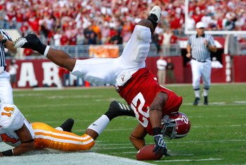TUSCALOOSA, AL - OCTOBER 24:  Mark Ingram #22 of the Alabama Crimson Tide is upended after leaping for more yardage against the Tennessee Volunteers at Bryant-Denny Stadium on October 24, 2009 in Tuscaloosa, Alabama.  (Photo by Kevin C. Cox/Getty Images)