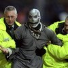 6 Nov 1999:  Halloween intruder is led away by stewards during the FA Carling Premiership match between Sheffield Wednesday and Watford at Hillsborough in Sheffield, England. \ Mandatory Credit: Mark Thompson /Allsport