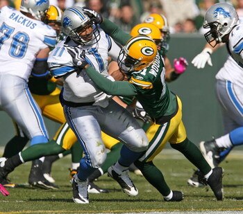 GREEN BAY, WI - OCTOBER 18: Charles Woodson #21 of the Green Bay Packers hits Daunte Culpepper #11 of Detroit Lions at Lambeau Field on October 18, 2009 in Green Bay, Wisconsin. The Packers defeated the Lions 26-0. (Photo by Jonathan Daniel/Getty Images)