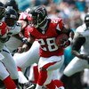 JACKSONVILLE, FL - SEPTEMBER 16:  Running back Warrick Dunn #28 of the Atlanta Falcons looks for room to run against the Jacksonville Jaguars at Alltel Stadium September 16, 2007 in Jacksonville, Florida. The Jaguars defeated the Falcons 13-7.  (Photo by 