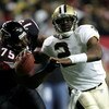 ATLANTA - DECEMBER 12:  Aaron Brooks #2 of the New Orleans Saints is chased from behind by Rod Coleman #75 of the Atlanta Falcons in NFL action December 12, 2005 at the Georgia Dome in Atlanta, Georgia.  (Photo By Streeter Lecka)