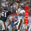 ATLANTA, GA - SEPTEMBER 15:  Quarterback Jim Miller #15 of the Chicago Bears throws a pass as he is blocked by Ellis Johnson #61 of the Atlanta Falcons on September 15, 2002  at the Georgia Dome in Atlanta, Georgia.  The Bears defeated the Falcons 14-13. 
