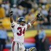 PITTSBURGH, PA - NOVEMBER 10:  Cornerback Ray Buchanan #34 of the Atlanta Falcons celebrates as quarterback Tommy Maddox #8 of the Pittsburgh Steelers picks himself up off the ground on November 10, 2002 at Heinz Field in Pittsburgh, Pennsylvania. The gam
