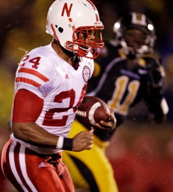 COLUMBIA, MO - OCTOBER 08:  Niles Paul #24 of the Nebraska Cornhuskers sprints toward the endzone for a touchdown as Jarrell Harrison #11 of the Missouri Tigers defends during the game on October 8, 2009 at Faurot Field/Memorial Stadium in Columbia, Misso