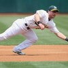 OAKLAND - JULY 10:  Jack Hannahan #22 of the Oakland Athletics leaps for the ball against the Seattle Mariners during a Major League Baseball game on July 10, 2008 at McAfee Coliseum in Oakland, California. (Photo by: Jed Jacobsohn/Getty Images)