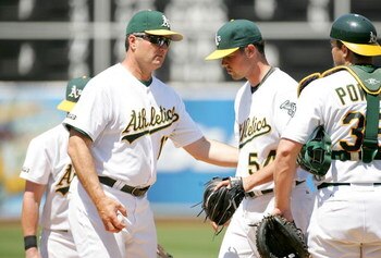 OAKLAND, CA - JUNE 28:  Manager Bob Geren takes out Vin Mazzaro #54 of the Oakland Athletics in the sixth inning of their game against the Colorado Rockies at the Oakland Coliseum on June 28, 2009 in Oakland, California.  (Photo by Ezra Shaw/Getty Images)