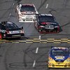 MARTINSVILLE, VA - OCTOBER 25:  Michael Waltrip, driver of the #55 NAPA Adaptive One Brakes Toyota, David Stremme, driver of the #12 Penske Dodge, and John Andretti, driver of the #34 A&W All American Hamburger Chevrolet, pass by Sam Hornish Jr., driver o