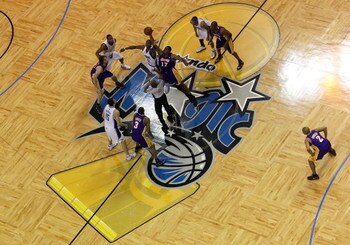 ORLANDO, FL - JUNE 14:  Andrew Bynum #17 of the Los Angeles Lakers and Dwight Howard #12 of the Orlando Magic go after the tip-off to start Game Five of the 2009 NBA Finals on June 14, 2009 at Amway Arena in Orlando, Florida.  NOTE TO USER:  User expressl