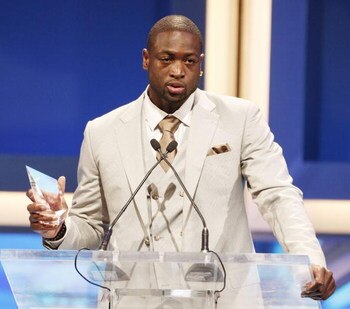 LOS ANGELES, CA - JUNE 07:  Miami Heats' Dwyane Wade accepts an award onstage at the Cedars-Sinai Medical Center's 24th Annual Sports Spectacular at the Century Plaza Hotel on June 7, 2009 in Los Angeles, California.  (Photo by Kevin Winter/Getty Images)