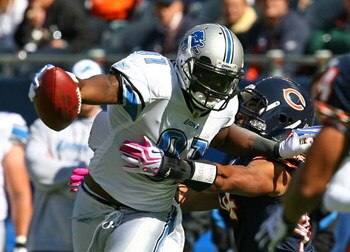CHICAGO - OCTOBER 04: Calvin Johnson #81 of the Detroit Lions breaks away from Kevin Payne #44 of the Chicago Bears on October 4, 2009 at Soldier Field in Chicago, Illinois. The Bears defeated the Lions 48-24. (Photo by Jonathan Daniel/Getty Images)