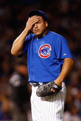 CHICAGO - OCTOBER 02:  Carlos Zambrano #38 of the Chicago Cubs wipes his forehead in the top of the second inning against the Los Angeles Dodgers in Game Two of the NLDS during the 2008 MLB Playoffs at Wrigley Field on October 2, 2008 in Chicago, Illinois