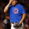 CHICAGO - OCTOBER 02:  Carlos Zambrano #38 of the Chicago Cubs wipes his forehead in the top of the second inning against the Los Angeles Dodgers in Game Two of the NLDS during the 2008 MLB Playoffs at Wrigley Field on October 2, 2008 in Chicago, Illinois