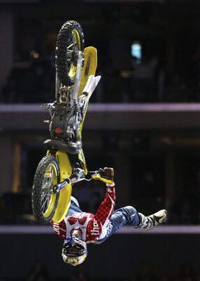 LOS ANGELES - AUGUST 4:  Travis Pastrana completes his first run in the Moto X Best Trick Final during the ESPN X Games on August 4, 2006 at the Staples Center in Los Angeles, California. Pastrana completed a double back flip on his second attempt and won