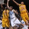 WESTWOOD, CA - FEBRUARY 4:  Spencer Soo #11 of the UCLA Bruins shoots between Mamadou Diarra #14 and Percy Miller #15 of the USC Trojans on February 4, 2009 at Pauley Pavillion in Westwood, California.   UCLA won 76-60.   (Photo by Stephen Dunn/Getty Imag