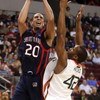 NORTH LITTLE ROCK, AR - MARCH 21:  Diamon Simpson #20 of the Saint Mary's Gaels shoots over Raymond Hicks #42 of the Miami Hurricanes during the first round of the South Regional as part of the 2008 NCAA Men's Basketball Tournament at Alltel Arena on Marc