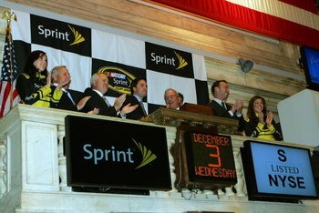 NEW YORK - DECEMBER 03:  2008 NASCAR Sprint Cup Series Champion winner Jimmie Johnson (4L), driver of the #48 Lowe's Chevrolet, attends the opening bell with (L-R) Miss Sprint Anne-Marie Rhodes, team owner Rick Hendricks, Chairmen and CEO of Lowe's Robert