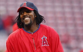 BOSTON - OCTOBER 5: Vladimir Guerrero #27 of the Los Angeles Angels of Anaheim enjoys a laugh before game three of the American League Division Series against the Boston Red Sox at Fenway Park on October 5, 2008 in Boston, Massachusetts. (Photo by Jim Rog