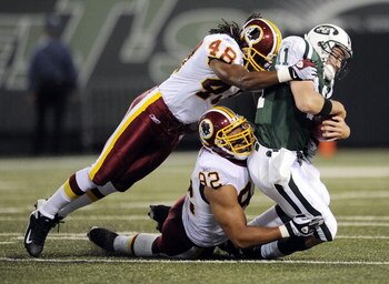 EAST RUTHERFORD, NJ - AUGUST 16:  Kellen Clemens #11 of the New York Jets  is sacked by Chris Horton #48 and Antwaan Randle El #82 of the Washington Redskins in a pre-season NFL game at Giants Stadium, August 16, 2008 in East Rutherford, New Jersey.  (Pho