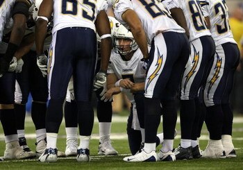 INDIANAPOLIS - JANUARY 13:  Billy Volek #7 of the San Diego Chargers calls a play in the offensive huddle the Indianapolis Colts during their AFC Divisional Playoff game at the RCA Dome on January 13, 2008 in Indianapolis, Indiana. The Chargers won 28-24.