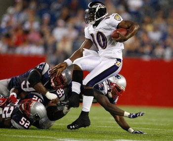 FOXBORO, MA - AUGUST 7:  Troy Smith #10 of the Baltimore Ravens is sacked by Eric Alexander #52 and Kenny Smith #95 of the New England Patriots during a preseason game at Gillette Stadium on August 7, 2008 in Foxboro, Massachusetts. (Photo by Jim Rogash/G