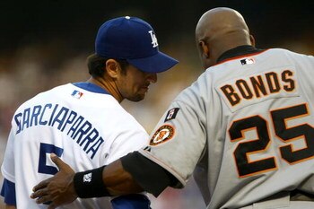 LOS ANGELES, CA - AUGUST 02:  Nomar Garciaparra #5 of the Los Angeles Dodgers talks with Barry Bonds #25 of the San Francisco Giants at third base in the first inning at Dodger Stadium on August 2, 2007 in Los Angeles, California.  (Photo by Stephen Dunn/