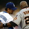 LOS ANGELES, CA - AUGUST 02:  Nomar Garciaparra #5 of the Los Angeles Dodgers talks with Barry Bonds #25 of the San Francisco Giants at third base in the first inning at Dodger Stadium on August 2, 2007 in Los Angeles, California.  (Photo by Stephen Dunn/
