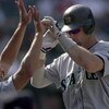 30 Sep 2000:  Jay Buhner #19 of the Seattle Mariners high fives Alex Rodriguez #3 as he moves to the dugout during the game against the Anaheim Angels at Edison Field in Anaheim, California. The Mariners defeated the Angels 21-9.Mandatory Credit: Jeff Gro