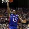 SAN ANTONIO - APRIL 05:  Mario Chalmers #15 of the Kansas Jayhawks goes up for a dunk while taking on the North Carolina Tar Heels during the National Semifinal game of the NCAA Men's Final Four at the Alamodome on April 5, 2008 in San Antonio, Texas.  (P