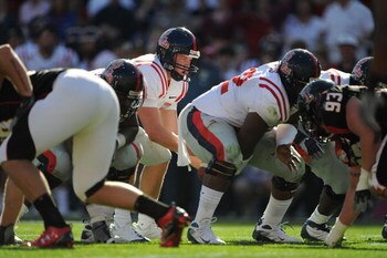 DALLAS - JANUARY 02:  Quarterback Jevan Snead #4 of the Mississippi Rebels drops back to pass against the Texas Tech Red Raiders during the AT&T Cotton Bowl on January 2, 2009 at the Cotton Bowl in Dallas, Texas.  (Photo by Ronald Martinez/Getty Images)