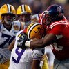 BATON ROUGE, LA - NOVEMBER 22:  Quarterback Jordan Jefferson #9 of the Louisiana State University Tigers is sacked by Peria Jerry #98 of the Ole Miss Rebels on November 22, 2008 at Tiger Stadium in Baton Rouge, Louisiana.  The Rebels defeated the Tigers 3