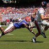 GAINESVILLE, FL - SEPTEMBER 27:  Quarterback Jevan Snead #4 of the Ole Miss Rebels runs for a touchdown against Brnadon Hicks #40 of the Florida Gators during the game at Ben Hill Griffin Stadium on September 27, 2008 in Gainesville, Florida.  (Photo by S