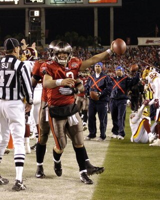 Tampa Bay Buccaneers quarterback Chris Simms scores a touchdown against the Washington Redskins in an NFL wild card playoff game January 7, 2006 in Tampa.  The Redskins defeated the Bucs 17 - 10.  (Photo by Al Messerschmidt/Getty Images)