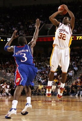 LOS ANGELES, CA - DECEMBER 02:  O.J. Mayo #32 of the USC Trojans puts up a shot over Russell Robinson #3 of the Kansas Jayhawks during the first half of the game at Galen Center on December 2, 2007 in Los Angeles, California.  (Photo by Christian Petersen