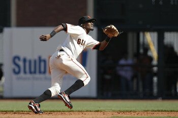 SAN FRANCISCO - APRIL 7:  Secondbaseman Eugenio Velez #8 of the San Francisco Giants takes off after a flyball against the San Diego Padres during an opening day game on April 7, 2008 at AT&T Park in San Francisco, California. San Diego won 8 to 4.  (Phot