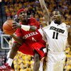 COLUMBIA, MO - FEBRUARY 14:  Cookie Miller #24 of the Nebraska Cornhuskers shoots as Zaire Taylor #11 of the Missouri Tigers defends during the game on February 14, 2009 at Mizzou Arena in Columbia, Missouri.  (Photo by Jamie Squire/Getty Images)