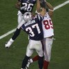 GLENDALE, AZ - FEBRUARY 03:  David Tyree #85 of the New York Giants catches a 32-yard pass from Eli Manning #10 as Rodney Harrison #37 of the New England Patriots attempts to knock it out in the fourth quarter of Super Bowl XLII on February 3, 2008 at the
