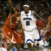 HOUSTON - MARCH 30:  Robert Dozier #2 of the Memphis Tigers drives the ball past Damion James #5 of the Texas Longhorns during the fourth round game of the South Regional as part of 2008 NCAA Men's Basketball Tournament at Reliant Stadium on March 30, 200