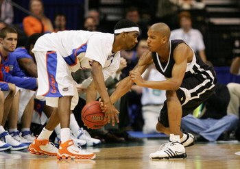 JACKSONVILLE, FL - MARCH 18:  Avery Smith #3 of the Wisconsin-Milwaukee Panthers defends against Corey Brewer #2 of the Florida Gators during round two of the NCAA National Championship on March 18, 2006 at the Veterans Memorial Arena in Jacksonville, Flo