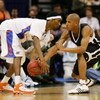 JACKSONVILLE, FL - MARCH 18:  Avery Smith #3 of the Wisconsin-Milwaukee Panthers defends against Corey Brewer #2 of the Florida Gators during round two of the NCAA National Championship on March 18, 2006 at the Veterans Memorial Arena in Jacksonville, Flo