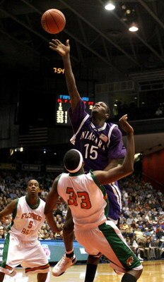 DAYTON, OH - MARCH 13:  Benson Egemonye #15 of the  Niagara Purple Eagles tries to get a shot off over Akini Adkins #33 of the Florida A&M Rattlers during the opening round of the Men's NCAA Tournament on March 13, 2007 at the University of Dayton Arena i