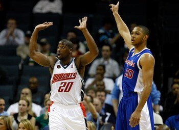 CHARLOTTE, NC - FEBRUARY 09:  Eric Gordon #10 of the Los Angeles Clippers and Raymond Felton #20 of the Charlotte Bobcats argue a call to a referee during their game at Time Warner Cable Arena on February 9, 2009 in Charlotte, North Carolina.  (Photo by S