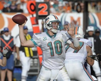 MIAMI, FL - JANUARY 4:  Quarterback Chad Pennington #10 of the Miami Dolphins sets to pass against the Baltimore Ravens in an NFL Wildcard Playoff Game at Dolphins Stadium on January 4, 2009 in Miami, Florida.  (Photo by Al Messerschmidt/Getty Images) 