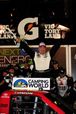 DAYTONA BEACH, FL - FEBRUARY 13:  Todd Bodine, driver of the #30 Toyota, celebrates after winning the NASCAR Camping World Truck Series NextEra Energy Resources 250 at Daytona International Speedway on February 13, 2009 in Daytona Beach, Florida.  (Photo 