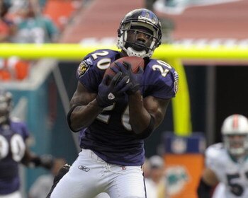 MIAMI, FL - JANUARY 4:  Safety Ed Reed #20 of the Baltimore Ravens intercepts a pass against the Miami Dolphins in an NFL Wildcard Playoff Game at Dolphins Stadium on January 4, 2009 in Miami, Floirda.  Reed ran for a touchdown with the interception. (Pho