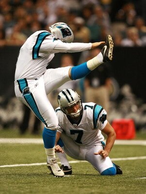 NEW ORLEANS - OCTOBER 07:  Place kicker John Kasay #4 of the Carolina Panthers kicks a field goal from under the hold of punter Jason Baker #7 while taking on the New Orleans Saints at the Superdome on October , 2007 in New Orleans, Louisiana. The Panther