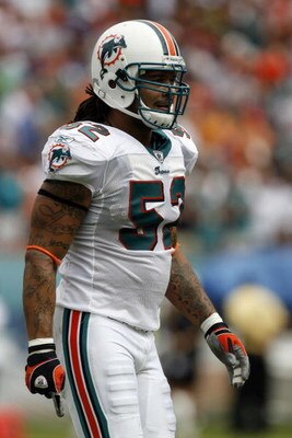 MIAMI - OCTOBER 19: Linebacker Channing Crowder #52 of the Miami Dolphins during a break in the action against the Baltimore Ravens in the first quarter at Dolphin Stadium on October 19, 2008 in Miami, Florida. (Photo by Eliot J. Schechter/Getty Images)